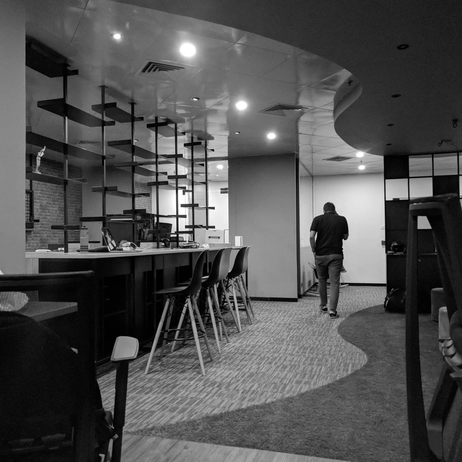 The studio workspace photographed in black and white