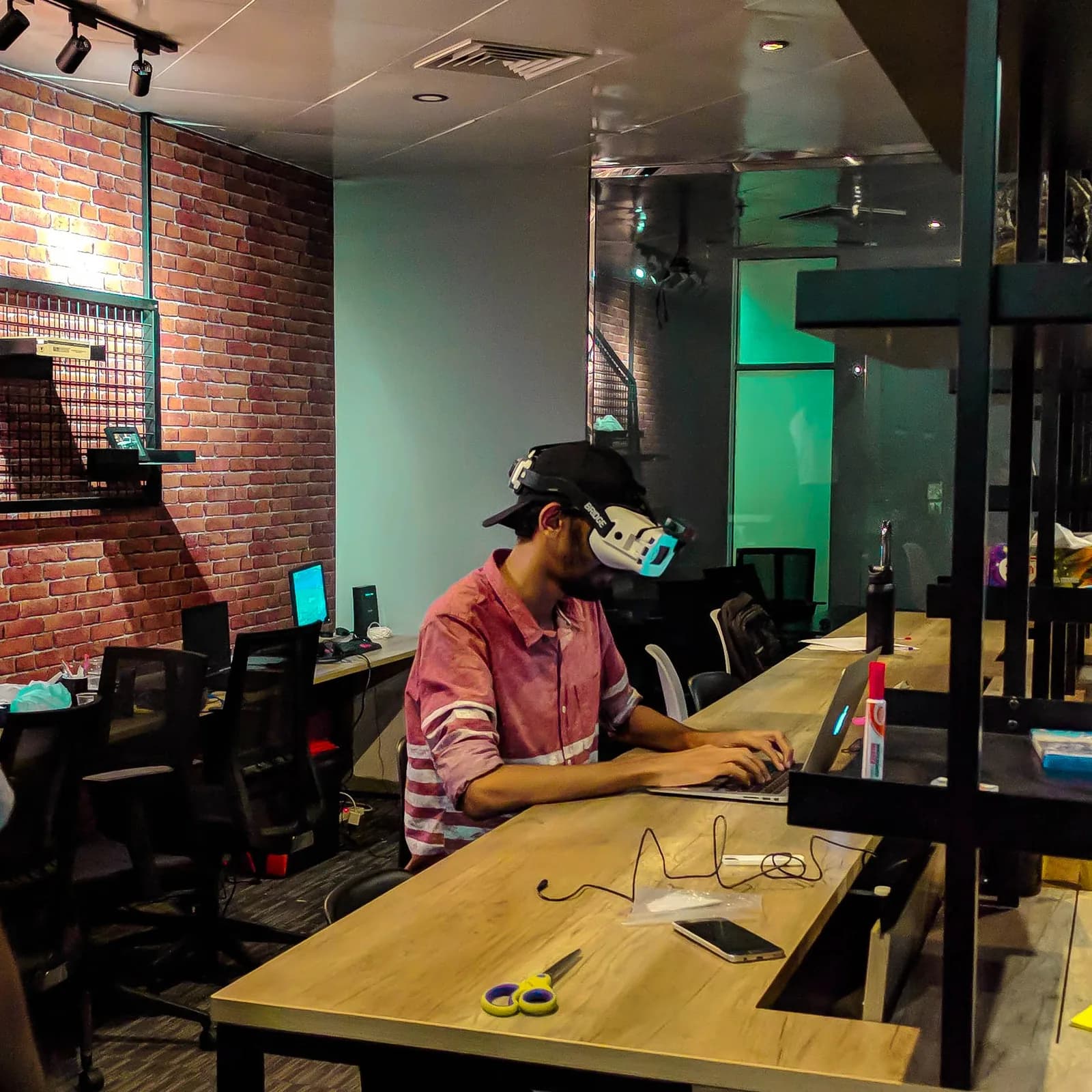 Testing a virtual reality headset at a studio desk