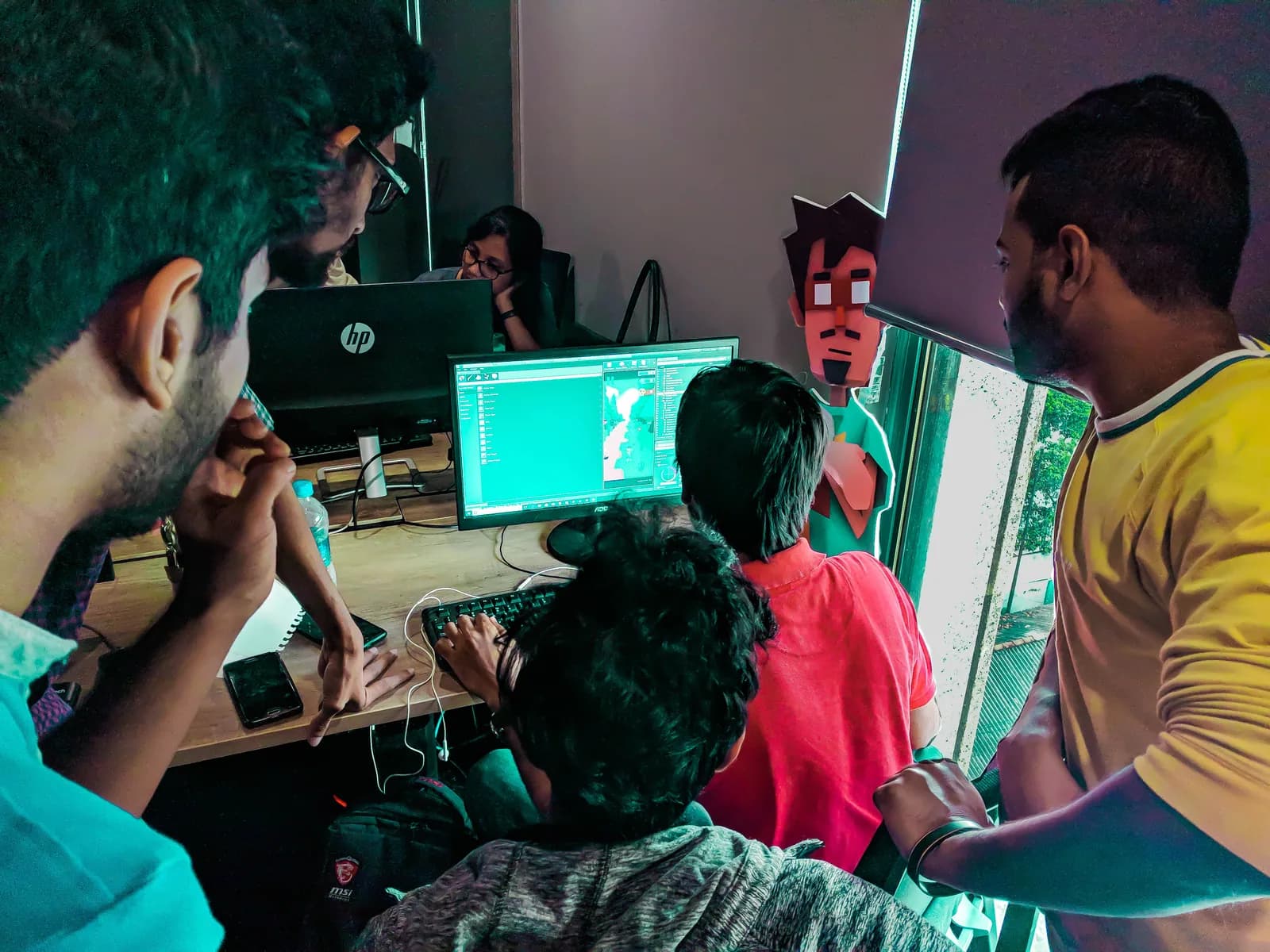 Artists reviewing their work together on a computer