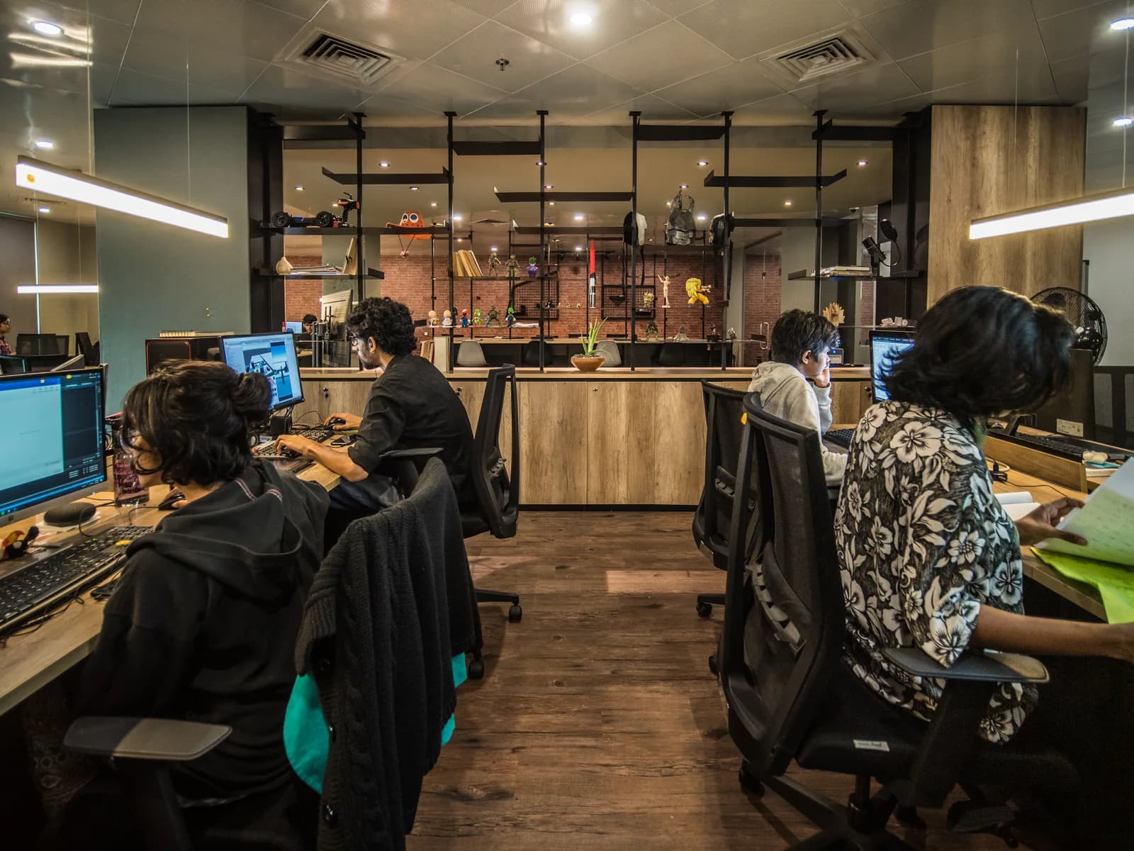 A view across the open studio and its shared desks