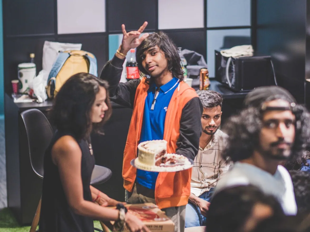 A team member at a shared studio celebration
